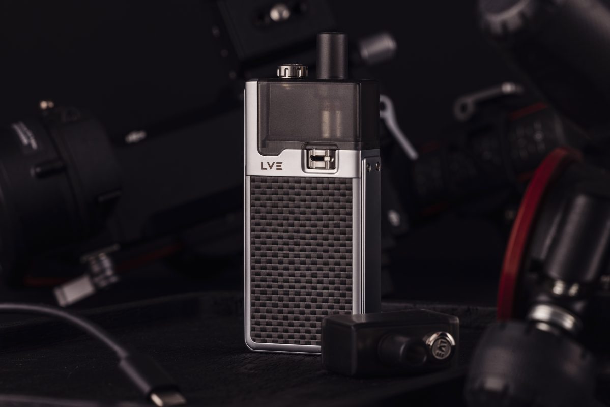 Silver orion ii device with textured carbon panels on a dark background